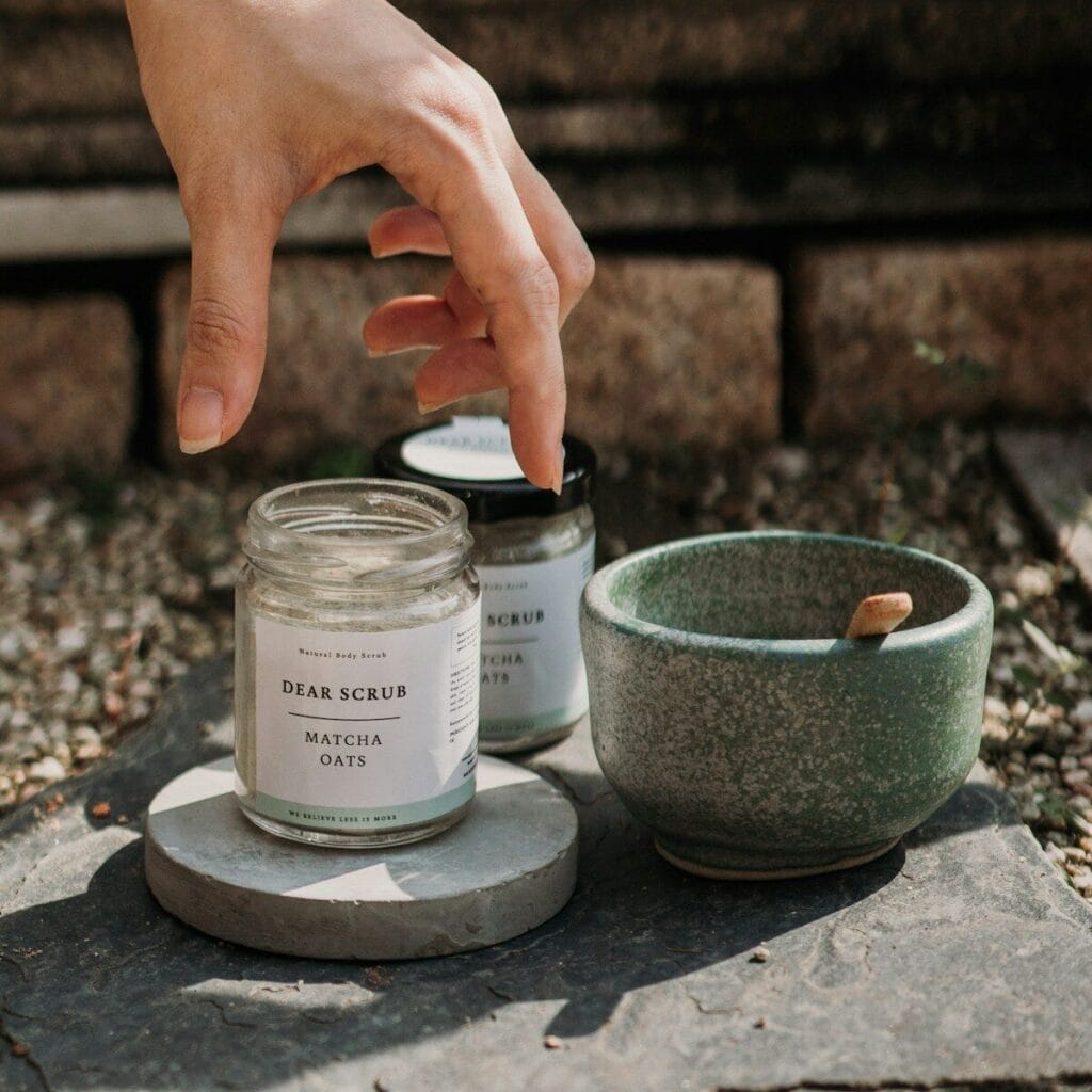 a hand reaching for a jar of matches