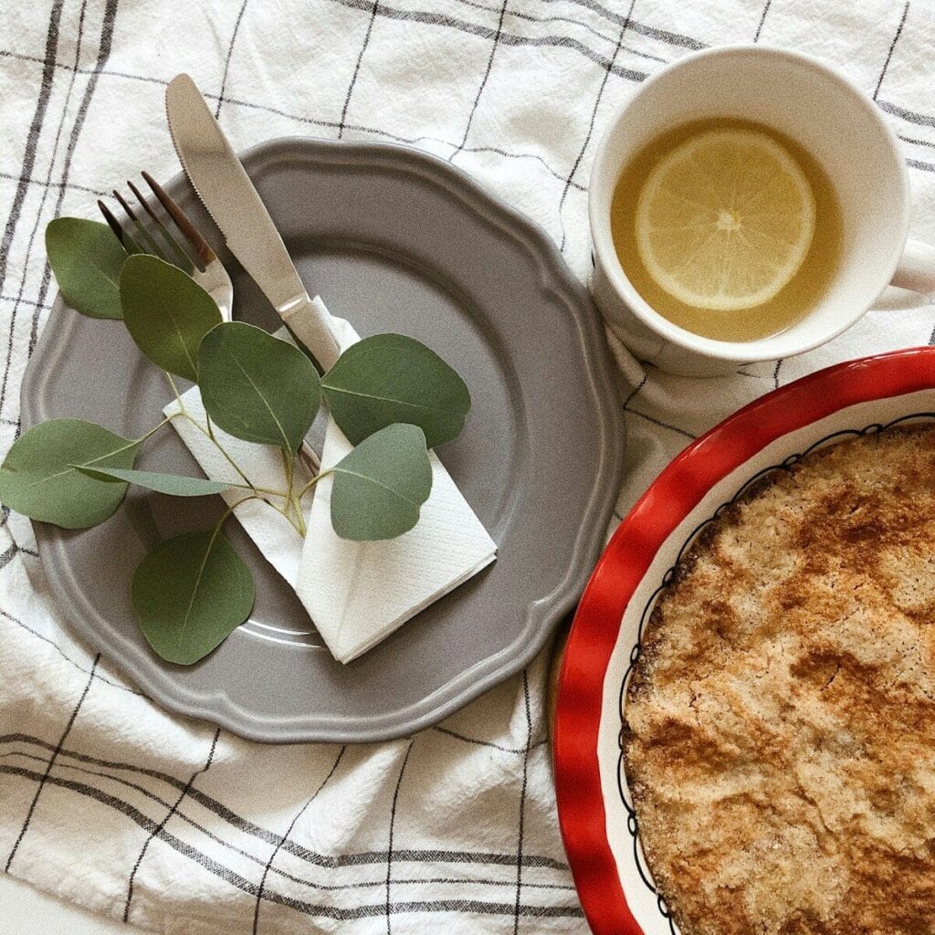 a pie and a cup of tea on a table