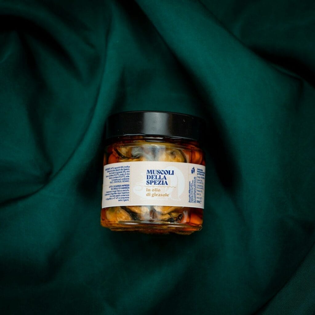 A jar of food sitting on top of a green cloth